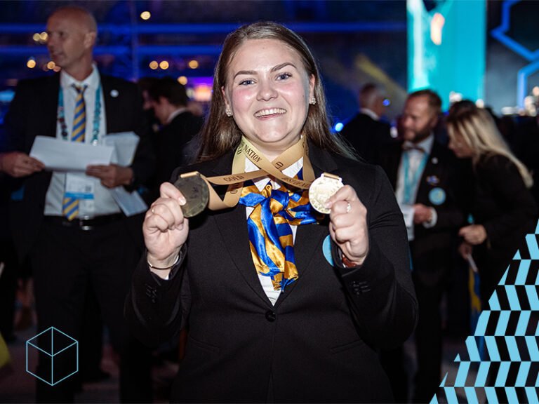Proud Swedish winner shows of her gold medal and her medal for best in nation